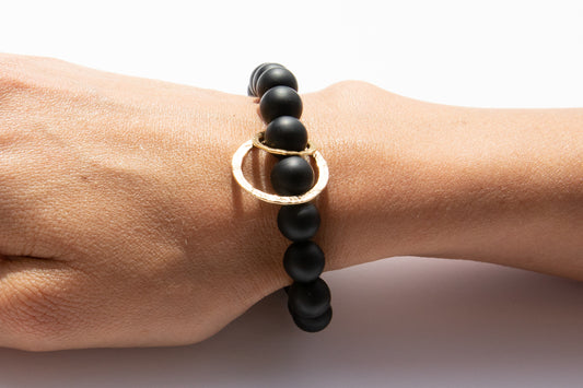 Black Onyx Beaded Bracelet + 14k Yellow Gold Circle Charms Displayed on Arm