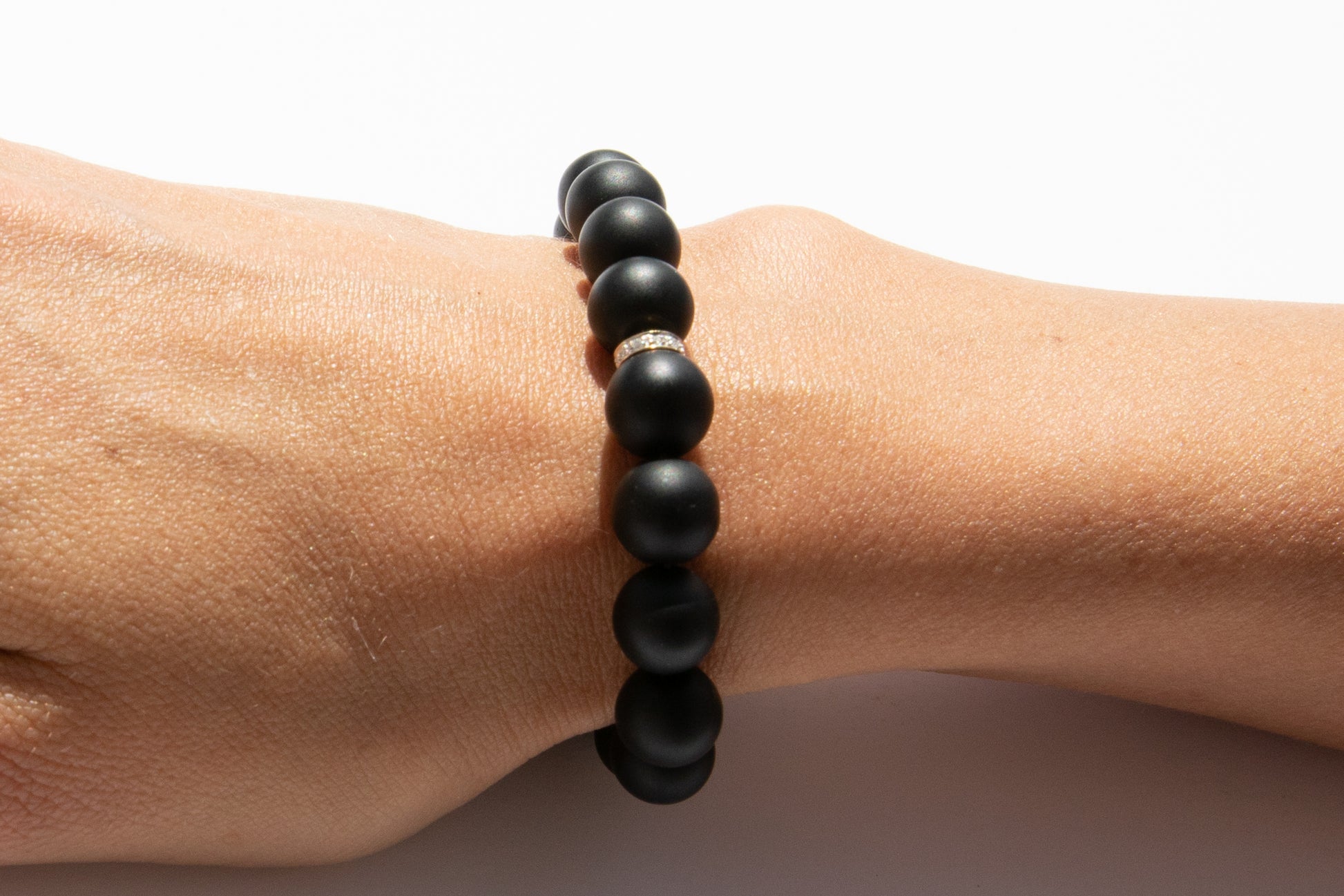 Black Onyx Beaded Bracelet With Pavé Diamonds Set in 14k Yellow Gold Pictured On Arm